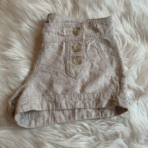 Linen shorts with front buttons.